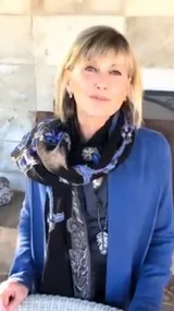 Olivia-Newton John wishes fans a happy new year.