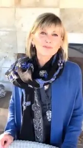 Olivia-Newton John wishes fans a happy new year.