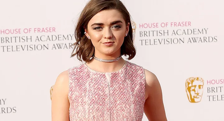 Actress in pink dress at British Academy Television Awards red carpet event.