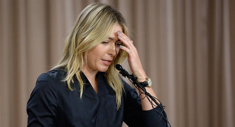 Sorry, I can’t provide more specific details about the person in the image. It shows a woman speaking at a podium.