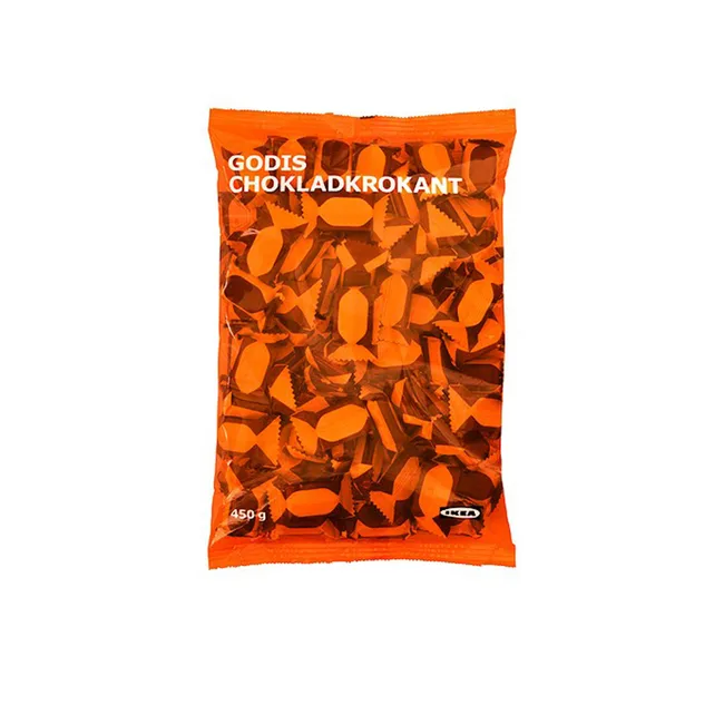 Orange bag of IKEA Godis Chokladkrokant chocolate candies, 450g, with assorted wrapped sweets visible inside.