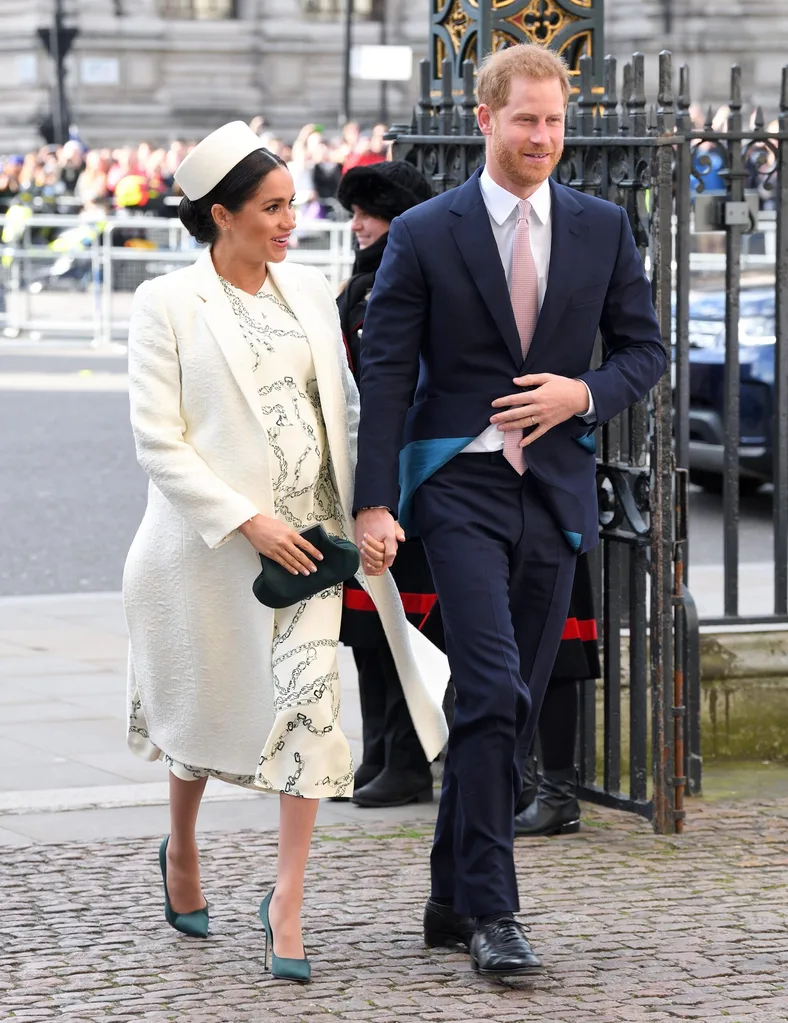 Meghan and Harry walk into a reception