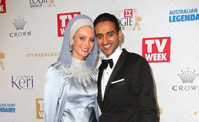 A couple poses at the TV Week Logie Awards 2016, smiling in formal attire, with branded backdrop.