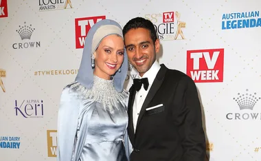 A couple poses at the TV Week Logie Awards 2016, smiling in formal attire, with branded backdrop.