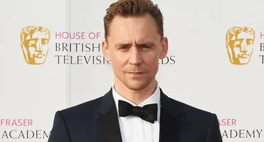 Actor in a tuxedo at the British Academy Television Awards red carpet event.