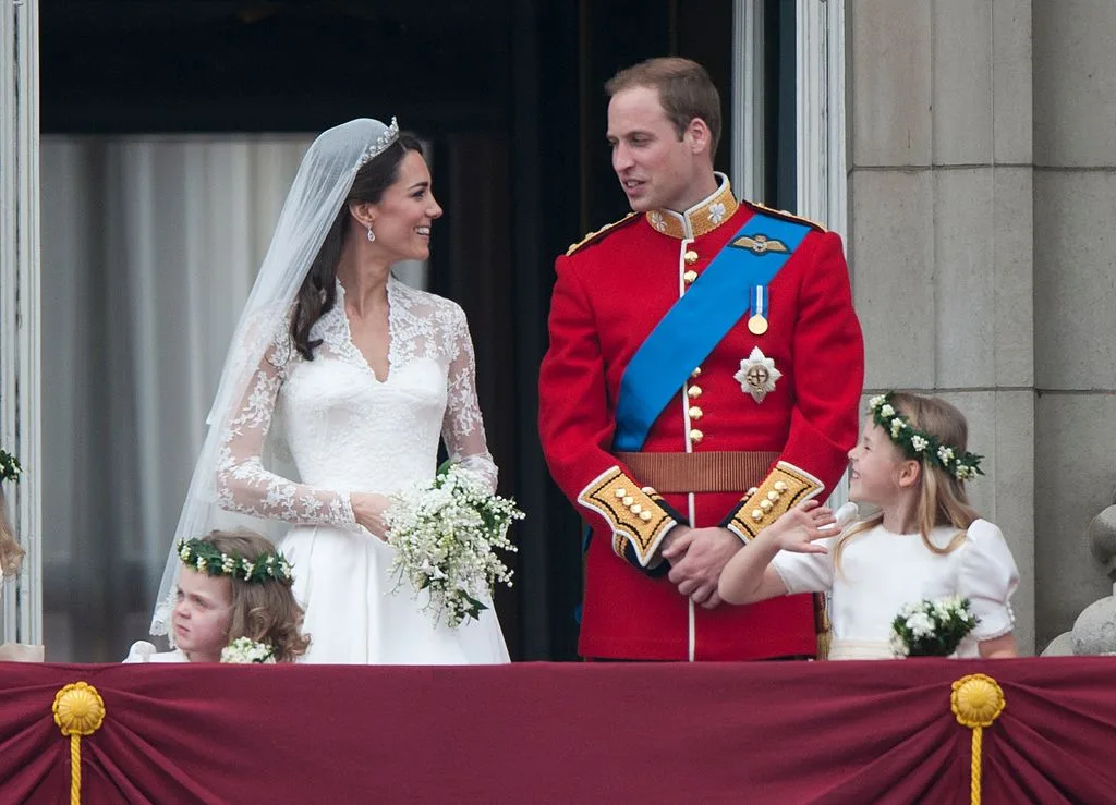 Prince William and his wife on the balcony of Buckingham Palace