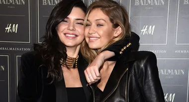 Two women smiling and posing together at an H&M Balmaination event.