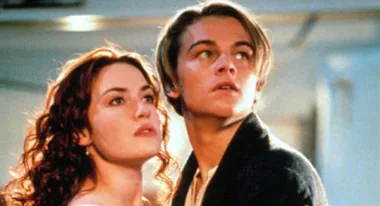 A young man and woman gaze upward in a dramatic scene from the movie "Titanic."