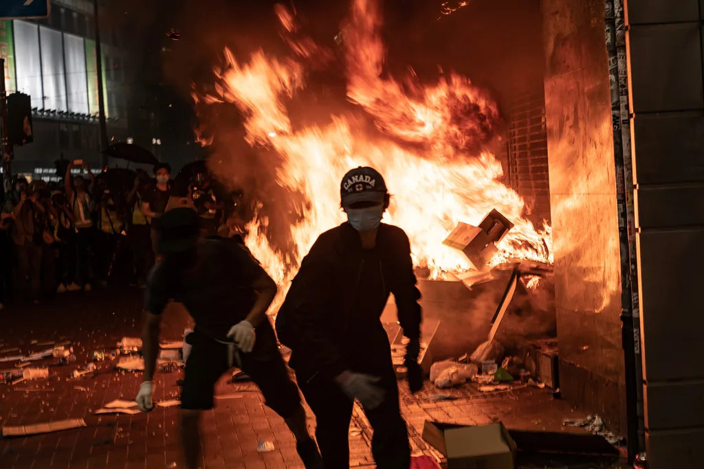 Pro-democracy protesters set a fire at the entrance of the MTR station during a demonstration at Causeway Bay district on October 4, 2019 in Hong Kong.