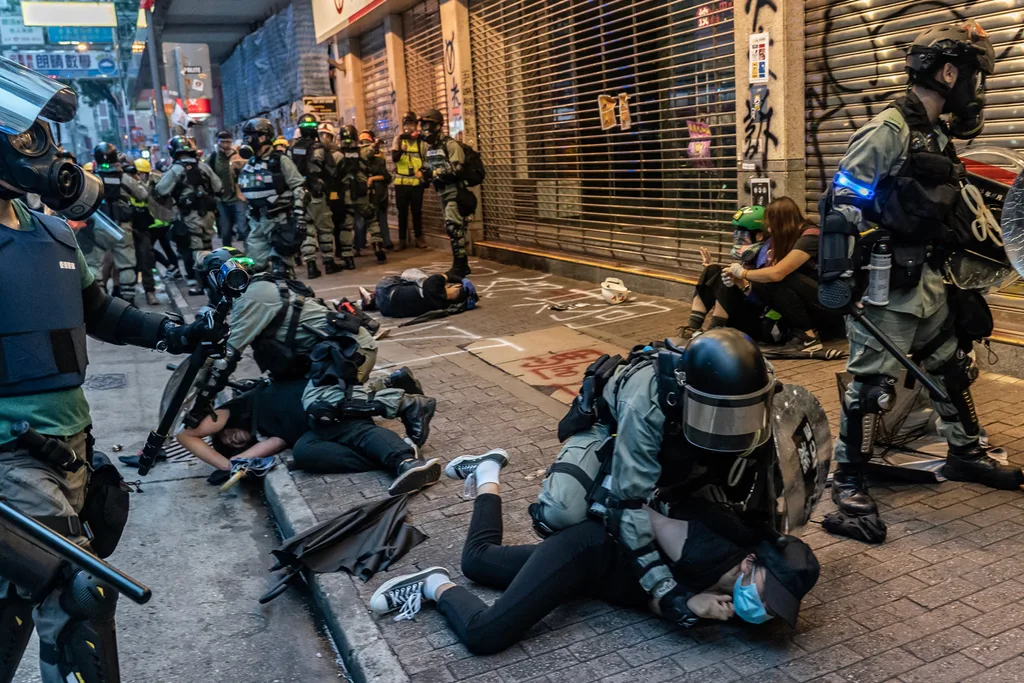 Pro-democracy protesters are arrested by police during a clash at a demonstration in Wan Chai district on October 6, 2019 in Hong Kong