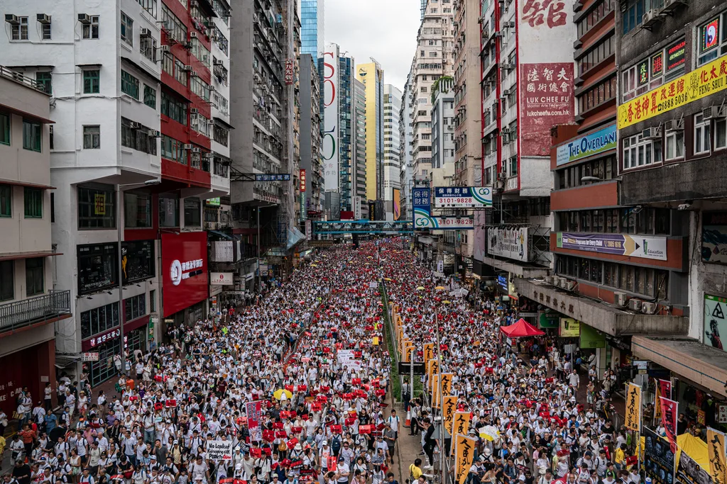 Protesters march on a street during a rally against the extradition law proposal on June 9, 2019 in Hong Kong.