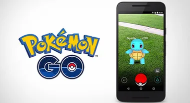 "Pokémon GO logo and smartphone screen showing Squirtle on virtual grass."