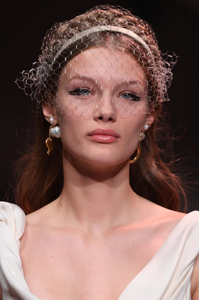 Headpieces featuring netting at Dior.