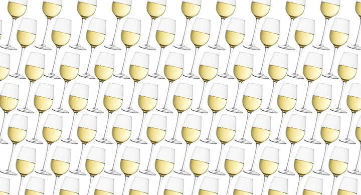Pattern of multiple white wine glasses arranged diagonally on a white background.