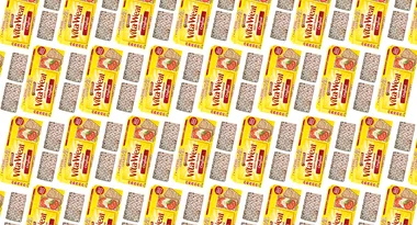 Pattern of yellow packaging for Arnott's Vita-Weat Crispbread with tomato and cheese image on the label.