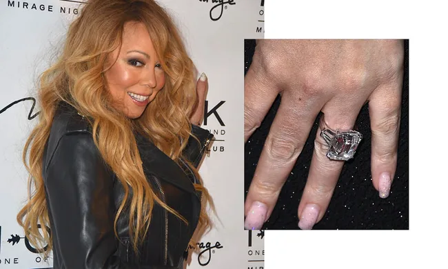 Blonde woman in leather jacket posing, with close-up of her hand wearing a large diamond ring.