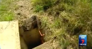 Open grassy hole with concrete edges and a channel entrance, aired on Channel 7 News.