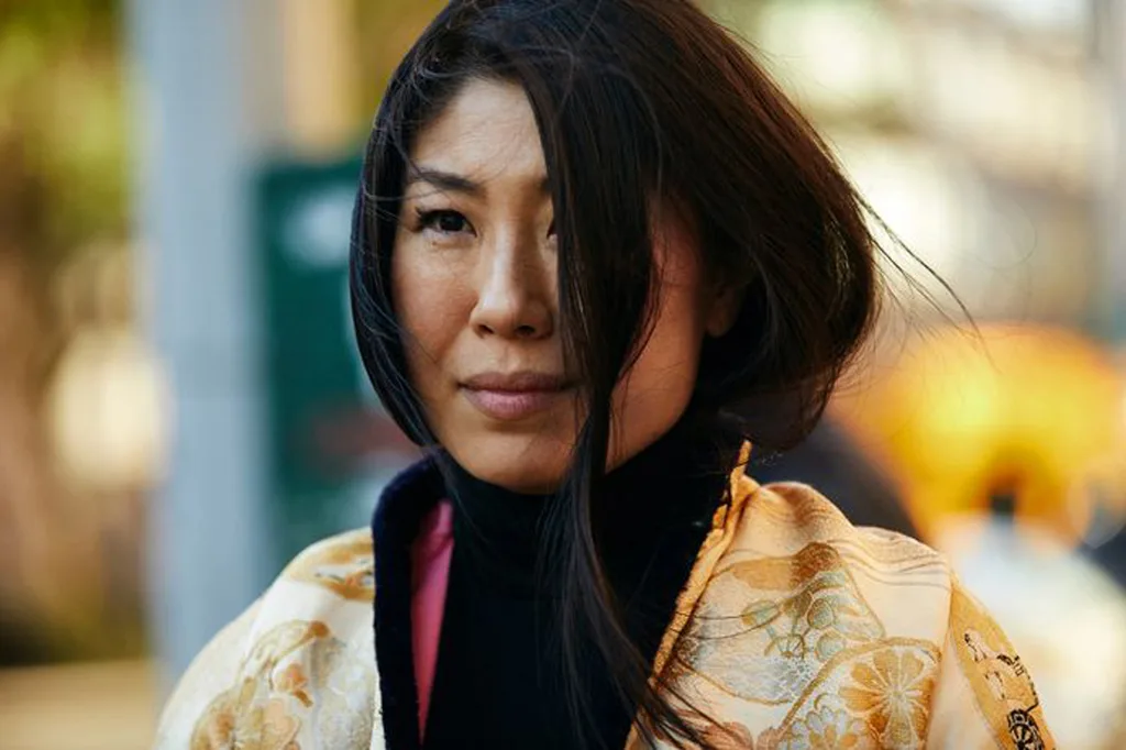 The author wearing a traditional Chinese jacket that belonged to her grandmother