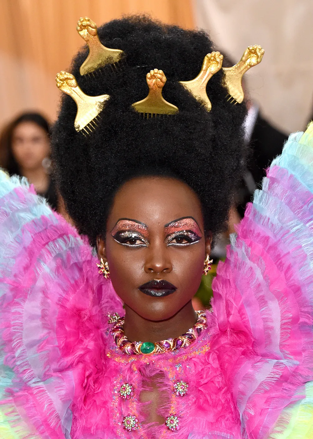 Lupita Nyong'o at the 2019 met gala ‘Camp: Notes on Fashion’ with combs in her hair