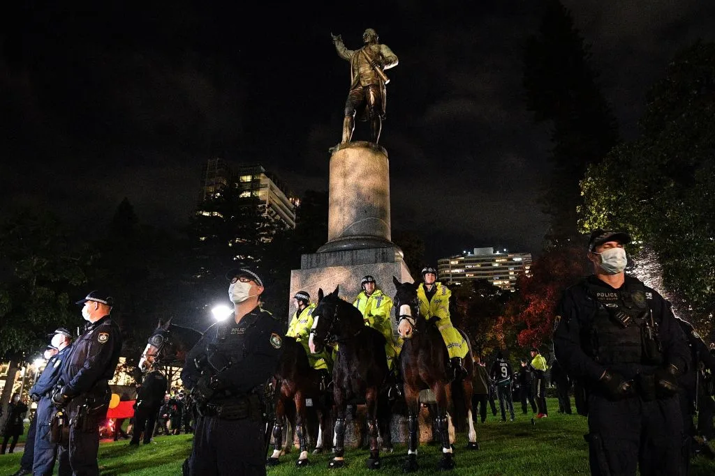 Police protecting the Captain Cool statue in Hyde Park during a protest rally against Aboriginal deaths in custody.