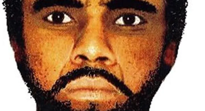 A close-up of a digitally created image showing a man's face with a beard and serious expression.