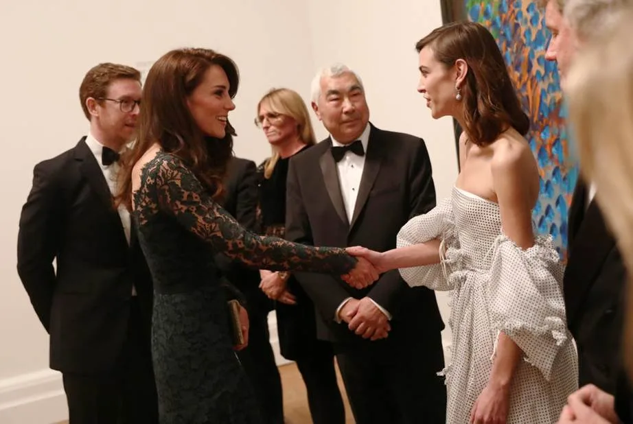 Alexa Chung meeting Kate Middleton in 2017.