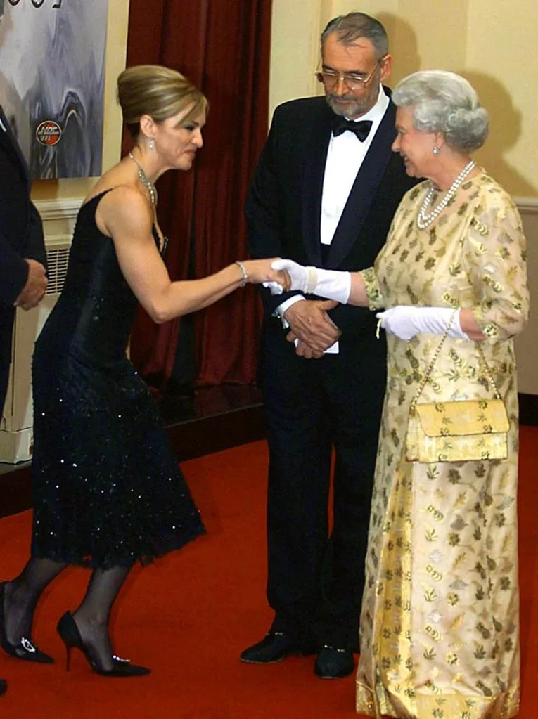 Madonna meeting Queen Elizabeth II in 2002.