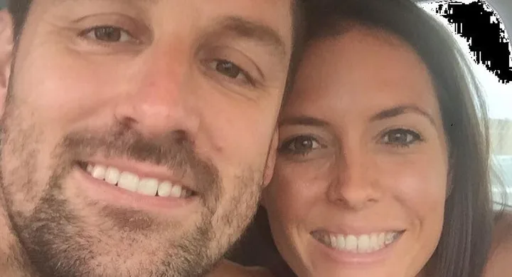 Two people smiling closely together in a selfie.