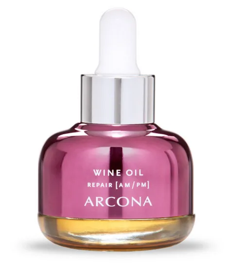 Arcona Wine Oil Repair serum with dropper cap in a silver and purple bottle.