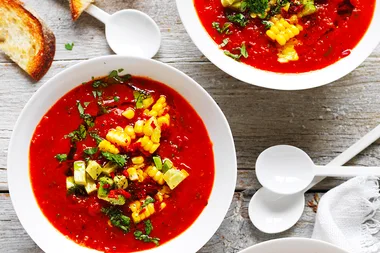 Mexican roast tomato soup with corn and avocado salsa