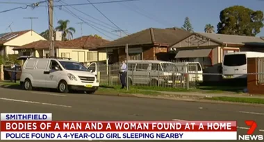 Police at a residential scene in Smithfield; caption reports discovery of deceased adults and child found asleep. Channel 7 News.