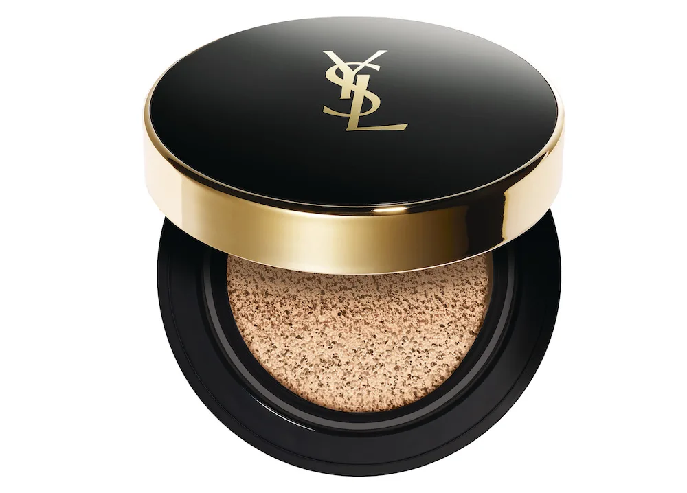 YSL logo black and gold compact case with cushion foundation inside.