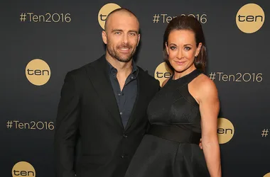 A man and woman in formal attire at a Ten Network event with #Ten2016 backdrop.
