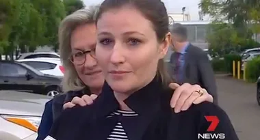 Two women are standing outside; one with glasses has her hands on the other's shoulders. A 7 News logo is on the bottom right.