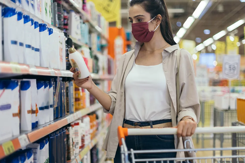 woman in supermarket with mask