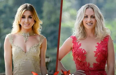 Two women in elegant dresses, one in gold and one in red, standing outdoors smiling at the camera.