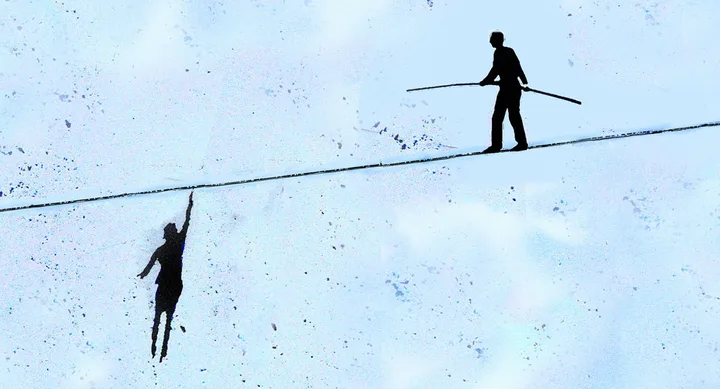 Visual of two silhouetted figures on a tightrope, one hanging and the other balancing with a pole, against a blue background.