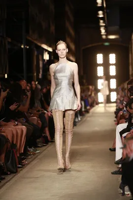 Model in a metallic dress and thigh-high boots walks the runway at Alex Perry SS13/14 fashion show.