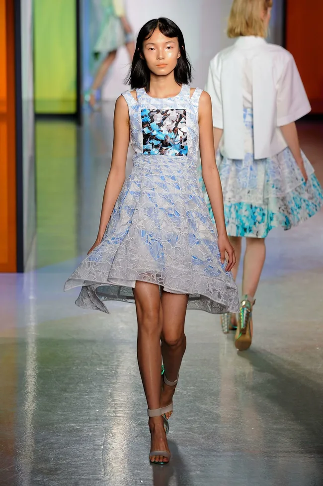 Model on runway wearing a light blue patterned dress with abstract print, Peter Pilotto SS14 fashion show.