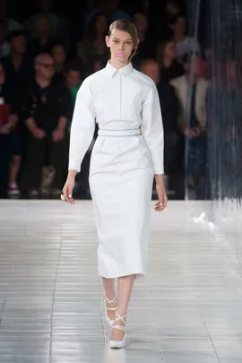 Model in a white dress walking down the runway at Prabal Gurung's Spring/Summer 2014 fashion show.