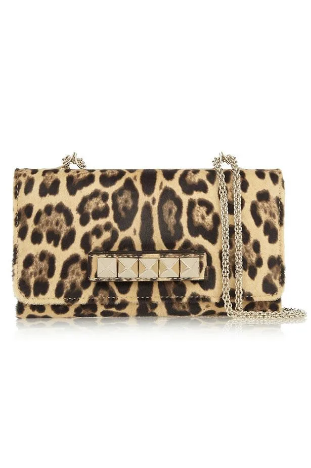 Leopard print chain-strap bag with gold stud accents on the front flap.