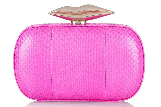 Pink textured clutch with a lip-shaped gold clasp.