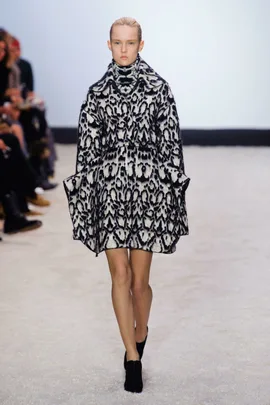 Model walking runway in black and white animal print coat at Giambattista Valli AW14/15 fashion show.