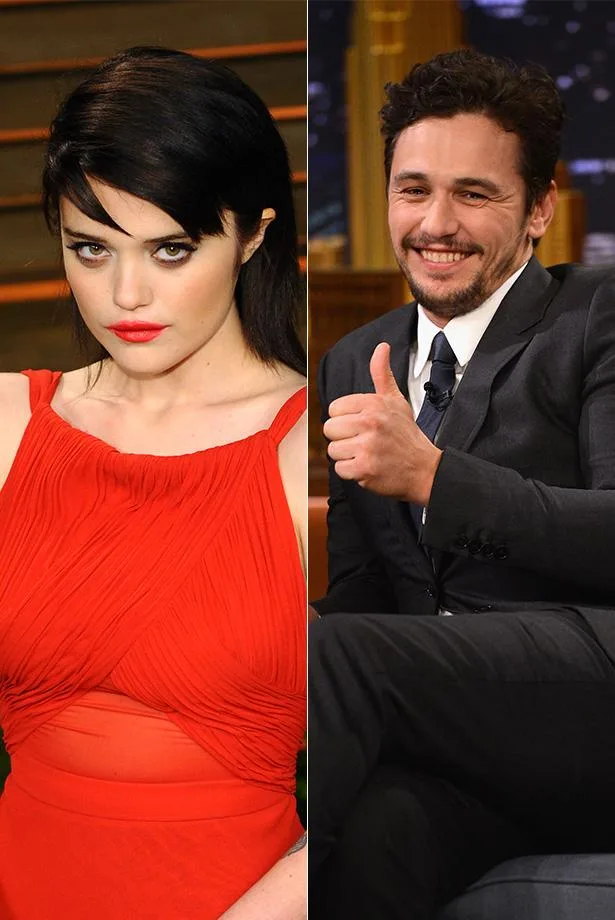 Two individuals side by side; one in a red dress, the other in a suit giving a thumbs-up.