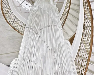 Spiral staircase with elegant white and gold design in Tiffany & Co.'s new Parisian store.