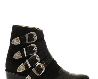 Black leather boot with five decorative silver buckles, pointed toe, and a low heel.