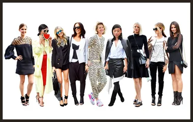 "Nine fashionably dressed women standing in a row against a white background."