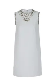 Light blue sleeveless shift dress with intricate jeweled embellishments around the neckline.