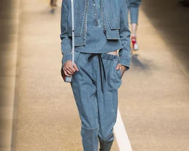 Model walking runway in denim outfit at Fendi Spring/Summer 2015 fashion show.