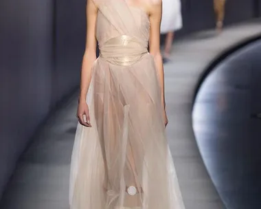 Model in sheer, one-shoulder gown walks runway at Vionnet Spring/Summer 2015 fashion show.